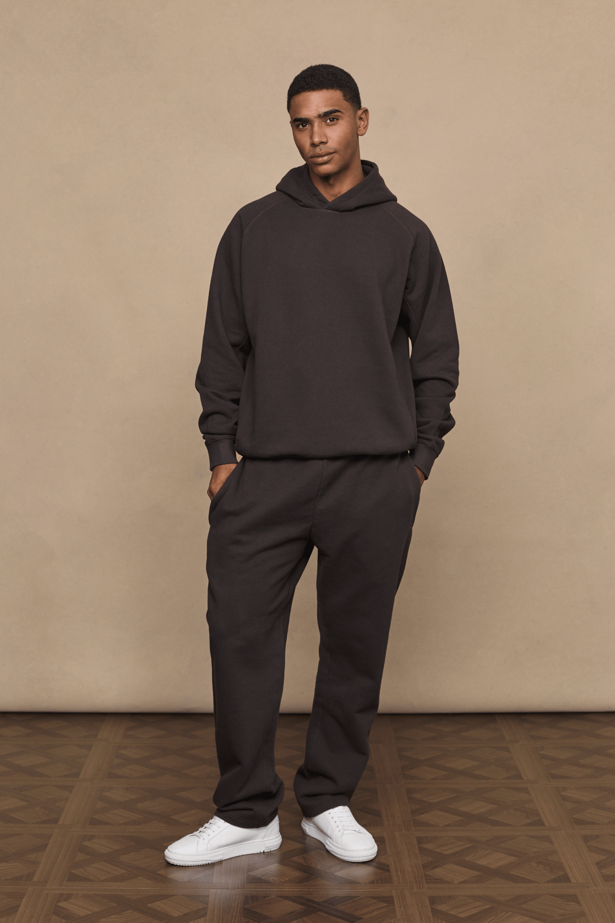 Men’s heavyweight cotton blend hoodie in dark brown with raglan sleeves by Raith