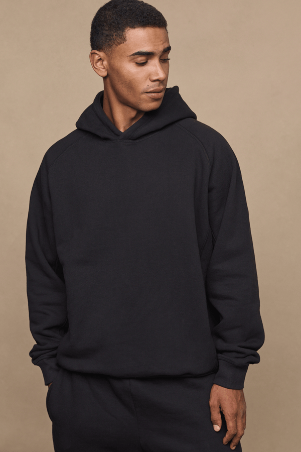 Men’s heavyweight cotton blend hoodie in Black with raglan sleeves by Raith