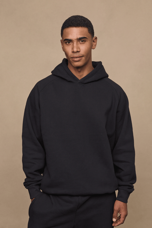 Men’s heavyweight cotton blend hoodie in Black with raglan sleeves by Raith